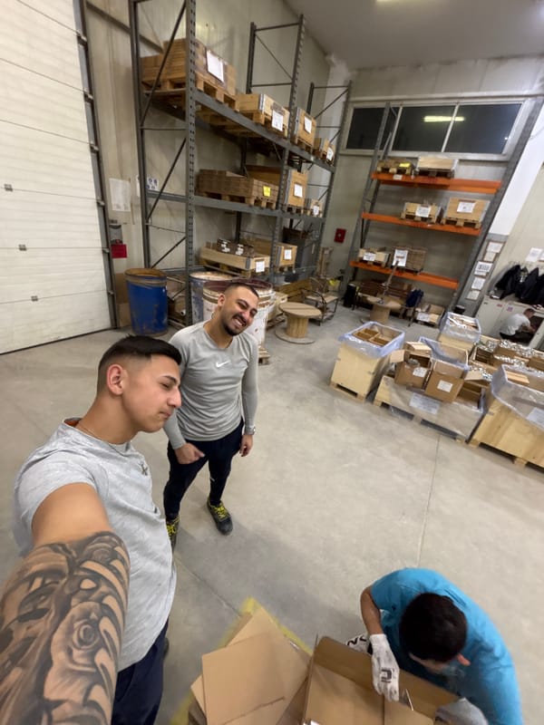 Workers pack items in warehouse during evening shift