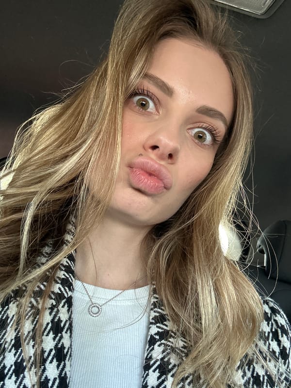 Woman takes selfies in car in Warsaw