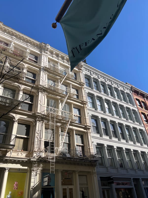 Construction crew operates boom lift on NYC street