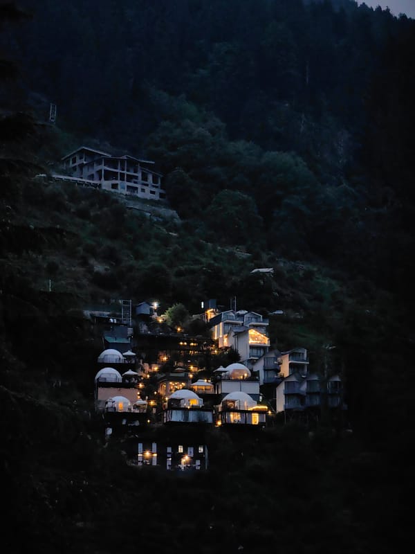 Hillside construction and forest views in Prini, Himachal Pradesh