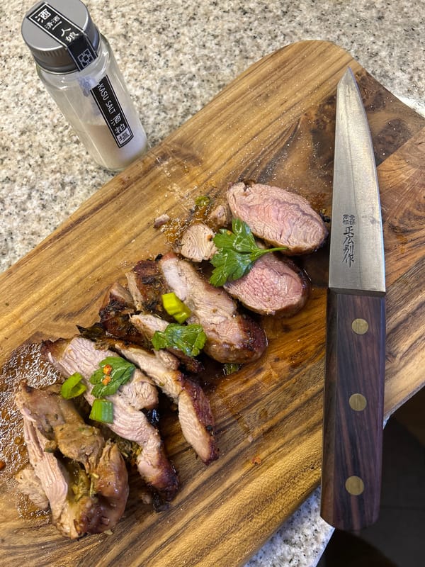 Home cook prepares seasoned meat in Riga kitchen