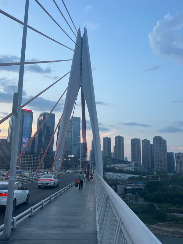 Chongqing's Yuzhong District at dusk, bridges to waterfront