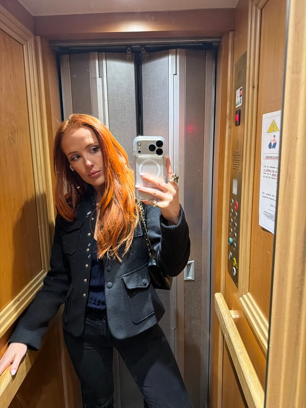 Woman takes elevator selfie in Paris