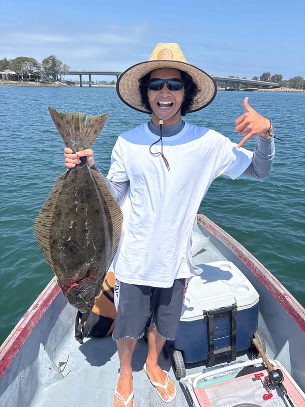 Fisherman shows off halibut catch in San Diego waters