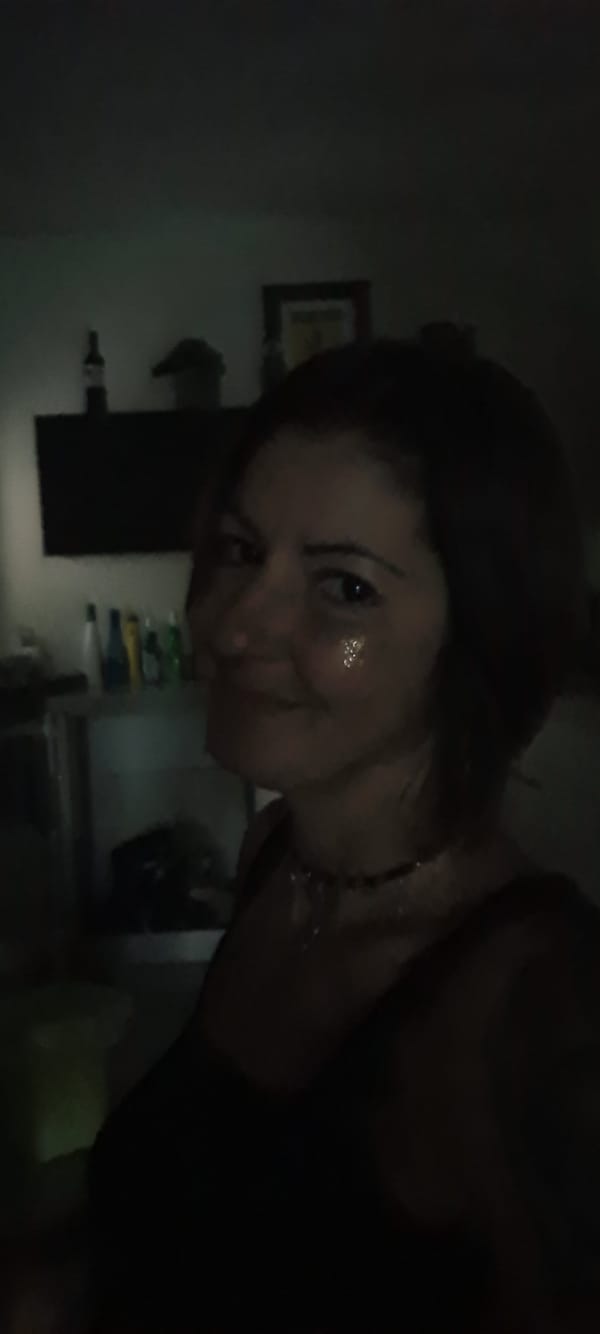 Woman photographed in dimly lit room in Rishon LeZion