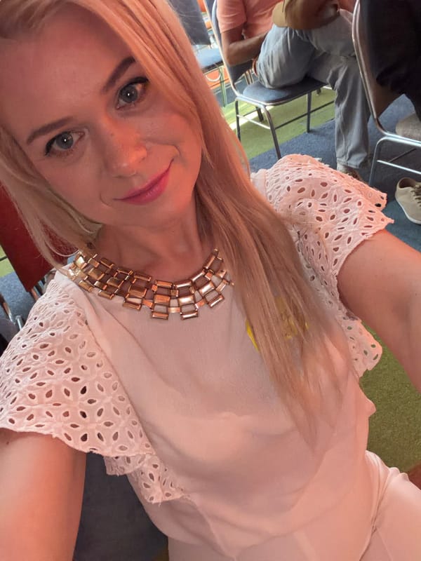 Selfie series at a Sochi indoor event, name tag visible