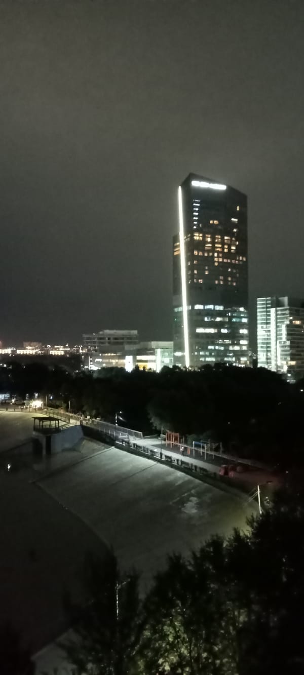 Almaty after dark: skyline, ski jumps, and waterfront lights