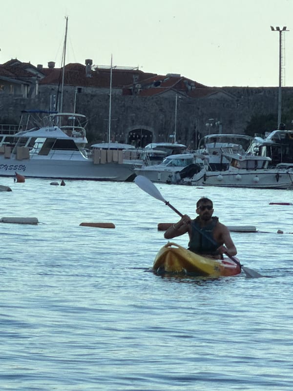 Late afternoon recreational activities observed across Budva waterfront and streets
