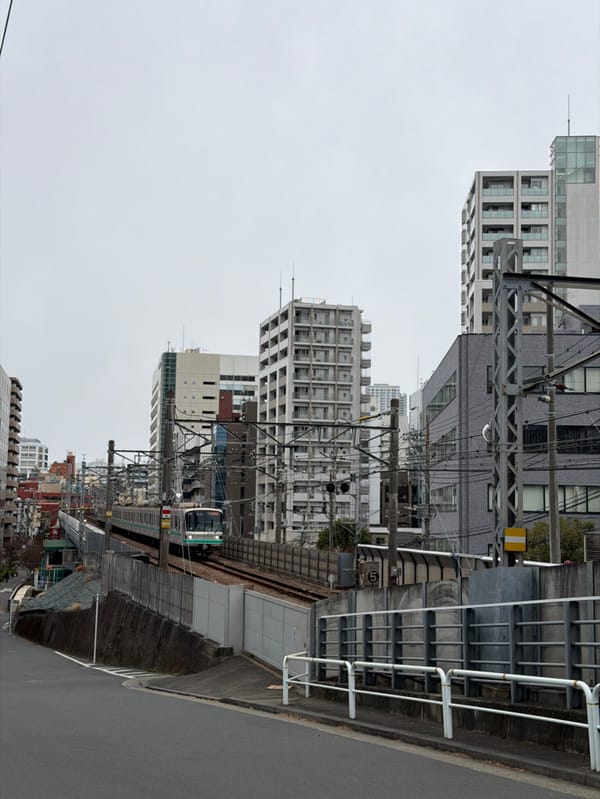 Train passes through Shinagawa district in Tokyo evening hours