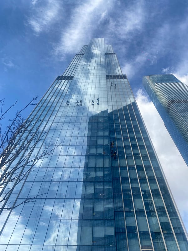 Window washers clean skyscraper facade in Khimki, Russia