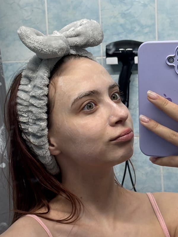 Evening skincare routine and pet moments in Russian home