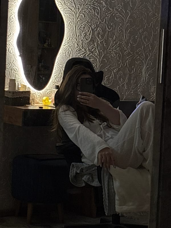 Woman takes selfies with small dog in Chaikovsky apartment