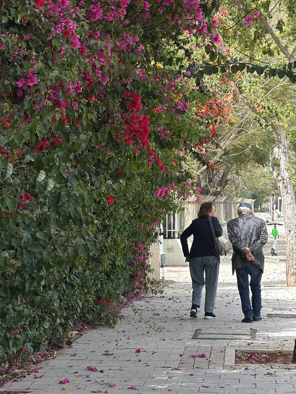 Pedestrians walk on Tel Aviv sidewalk Saturday morning