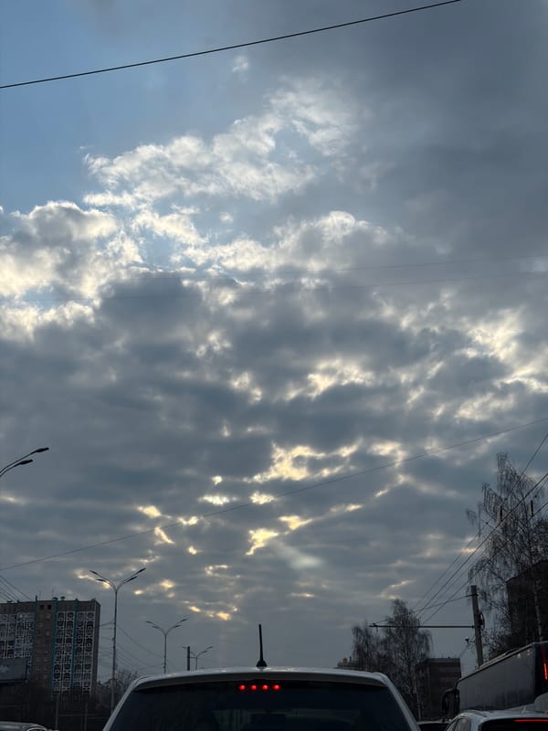 Sunlight breaks through gray clouds over Izhevsk, Russia