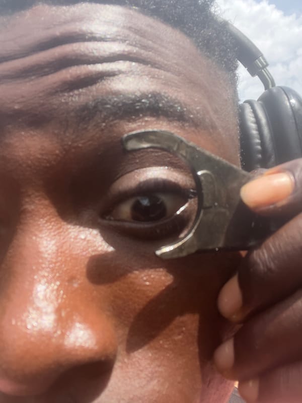 Mechanic repairs motorcycle engine on ground in Nkpor
