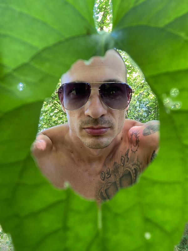Man poses for outdoor photo session in Pleven park