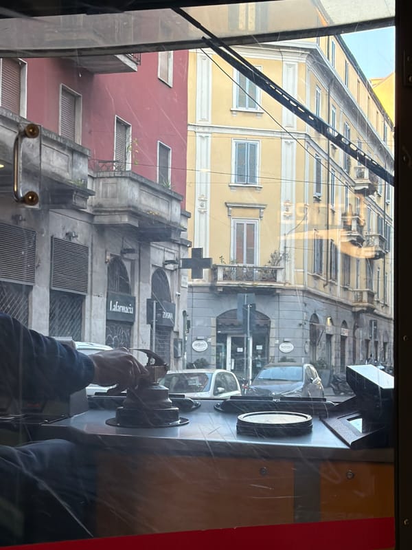 Early morning tram journey through Milan streets captured