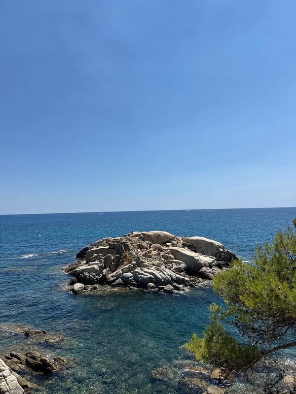Coastal trail day along Platja d'Aro's rocky Mediterranean shoreline