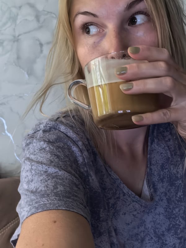 Sipping a hot drink from a glass mug in Sterlitamak