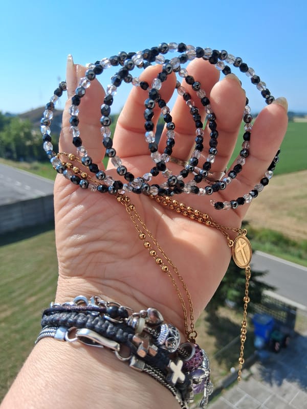 Morning jewelry and coffee ritual documented in Colorno, Italy