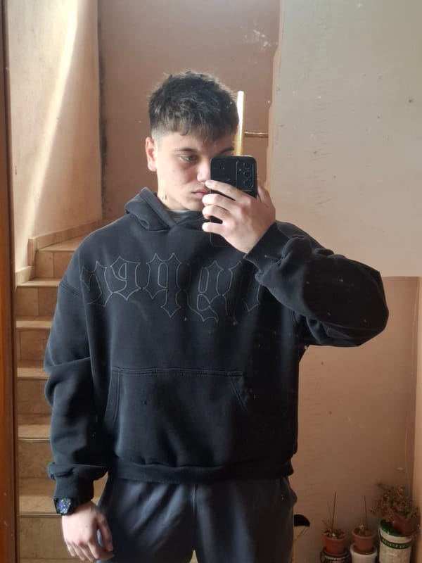 Young man takes mirror selfie in Veliki Preslav building
