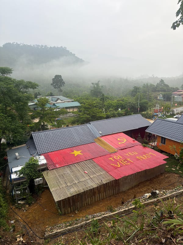 Hillside buildings with red roofs photographed in Da Nang