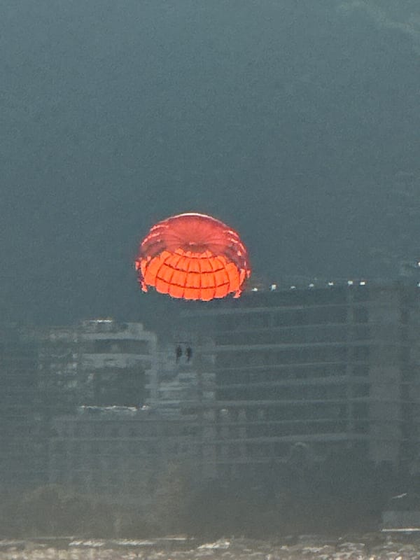 Parasailing and boats fill a busy Budva afternoon on the Adriatic