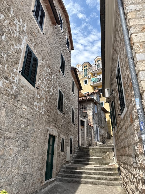 Exploring Herceg Novi's stone old town on a summer morning