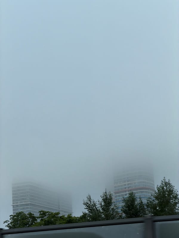 Moscow residential towers disappear into thick morning fog