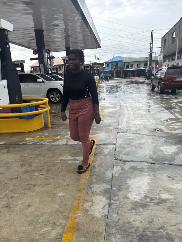 Rainy afternoon streets in Ado, schoolkids and daily life