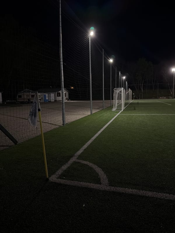 Empty soccer field illuminated at night in Pleven, Bulgaria