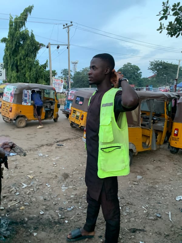Evening street activity at a roadside market in Abuja