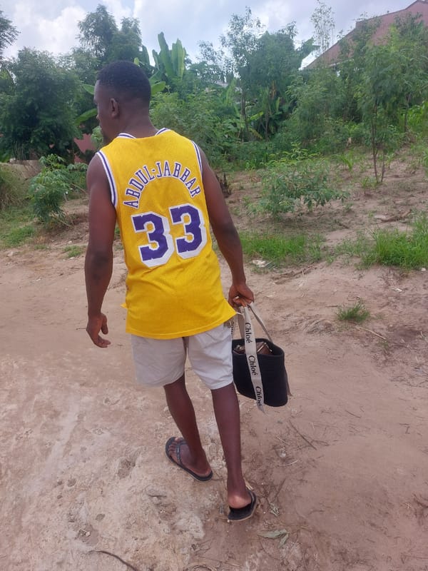Man in Lakers jersey spotted with designer purse in Dar es-Salaam