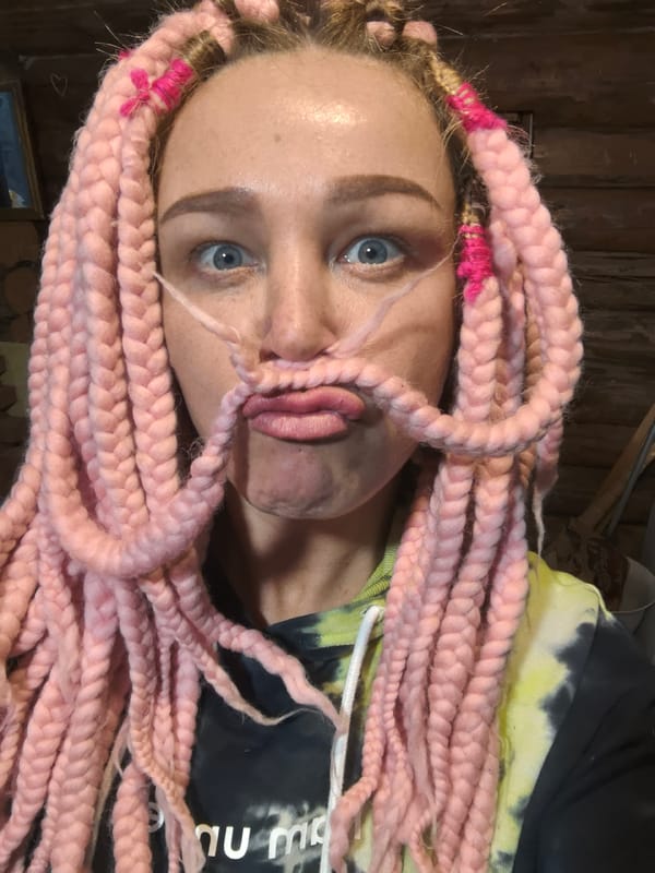 Woman chops wood outdoors in Novyi, Russia