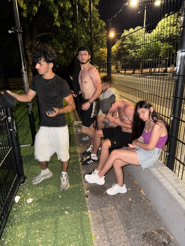Late-night scenes at a graffiti-tagged basketball court in Perpignan