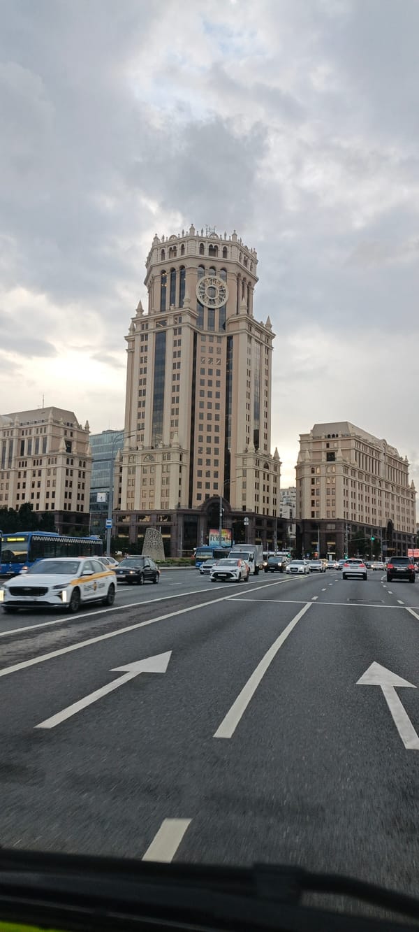Low-angle street view under overcast skies