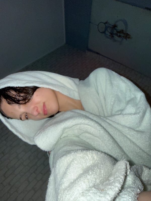 Woman in towel observed indoors in Sofia