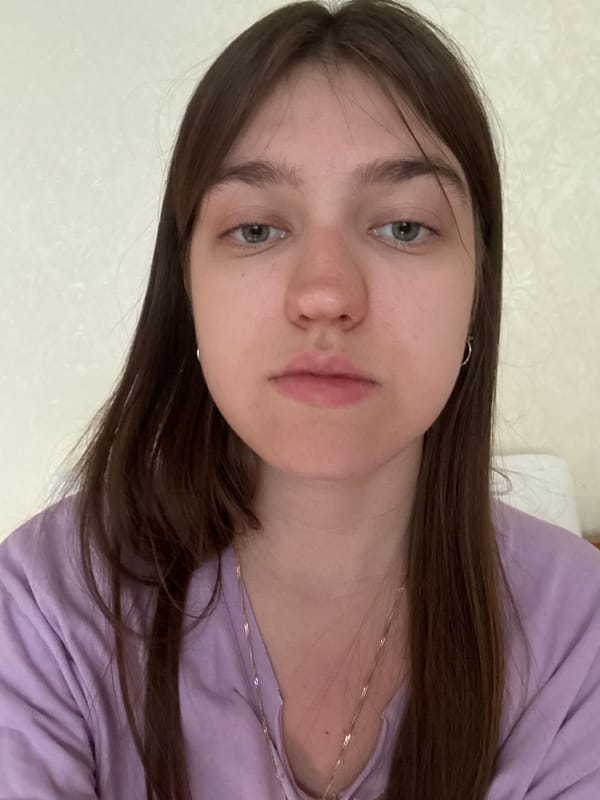 Woman in purple shirt photographed multiple times in bedroom