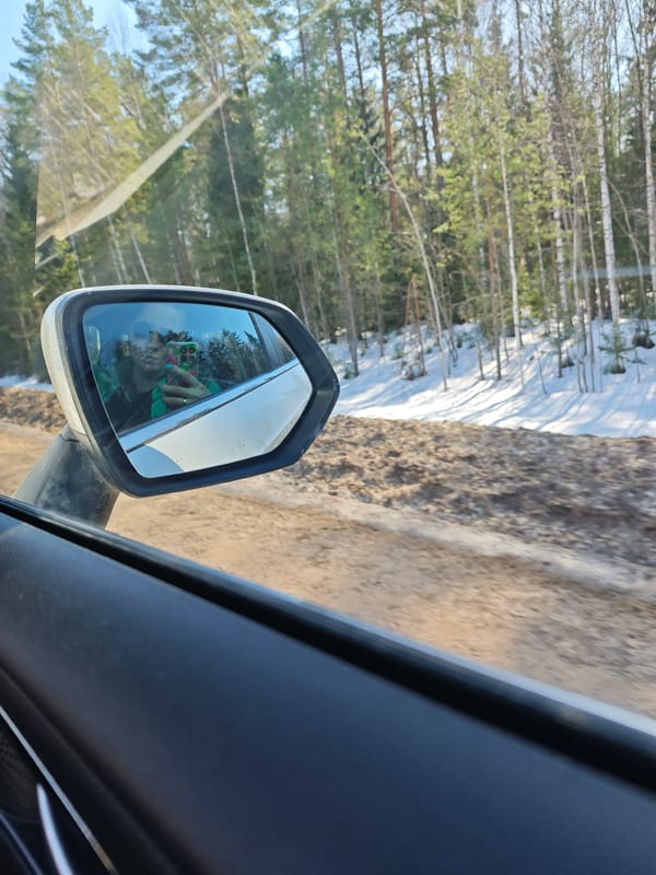 Woman takes car selfie on Russian dirt road