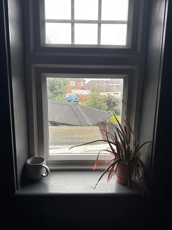 Rainy morning view documented through window in Hitchin
