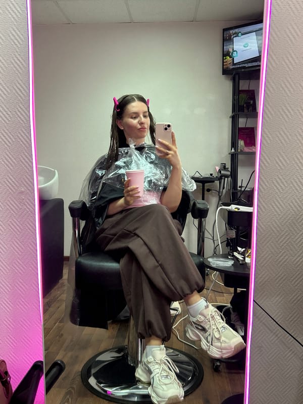 Woman receives hair treatment at salon in Klin, Russia