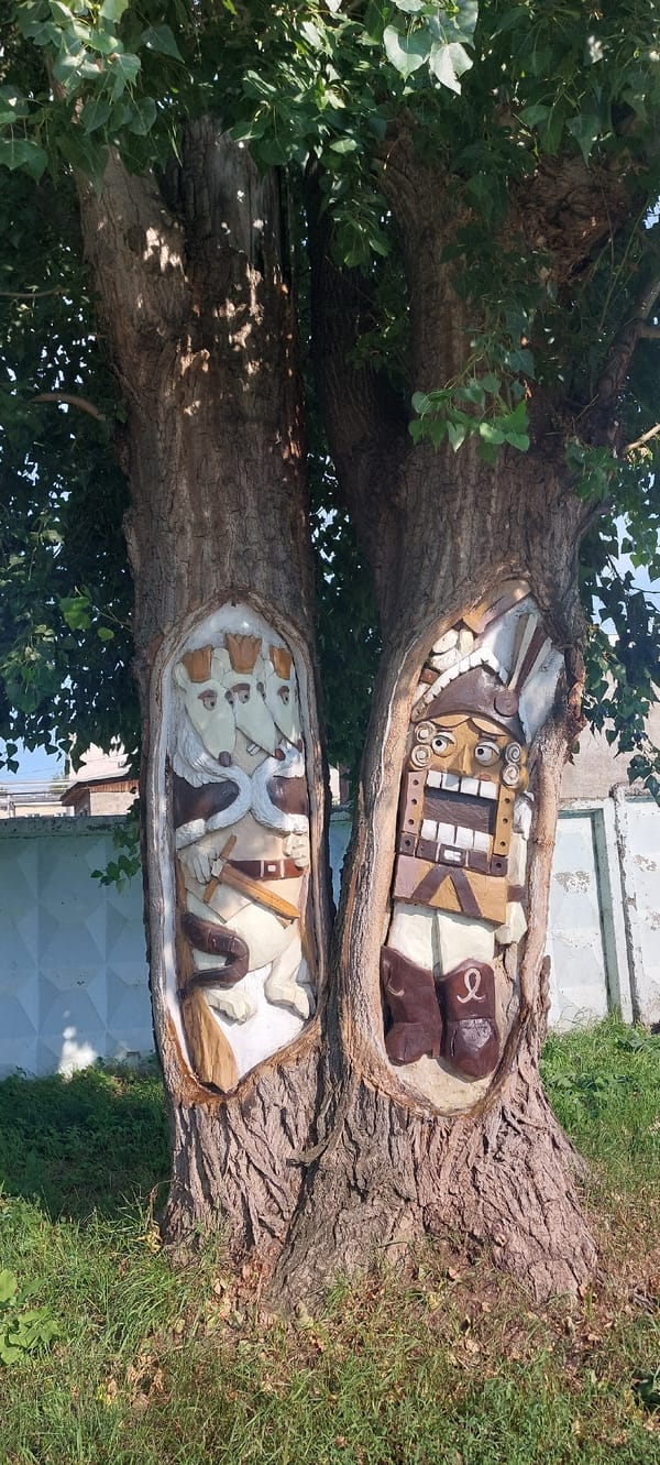 Chaikovsky's outdoor murals and wood carvings, mid-summer