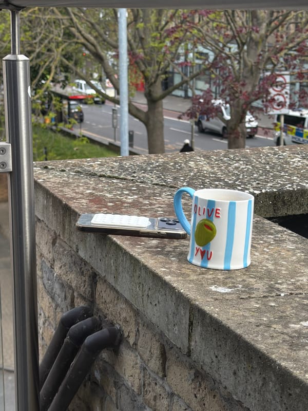 Coffee break captured on London street ledge Friday morning