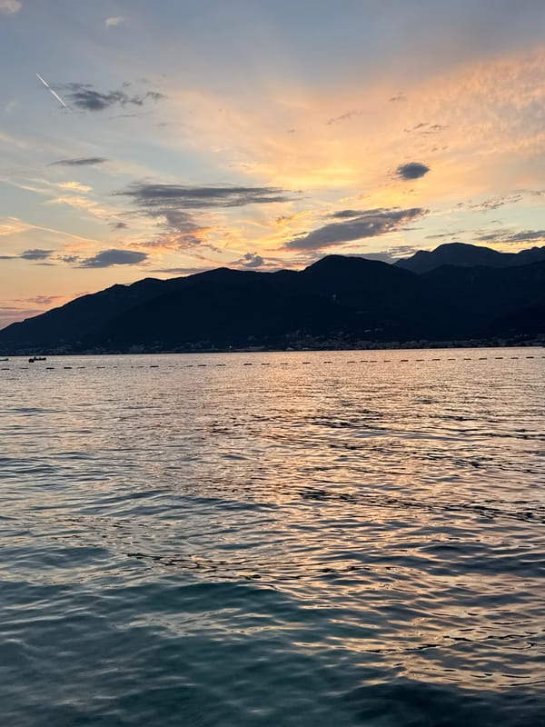 Sunset hours at a mountain waterfront, quiet and unhurried.