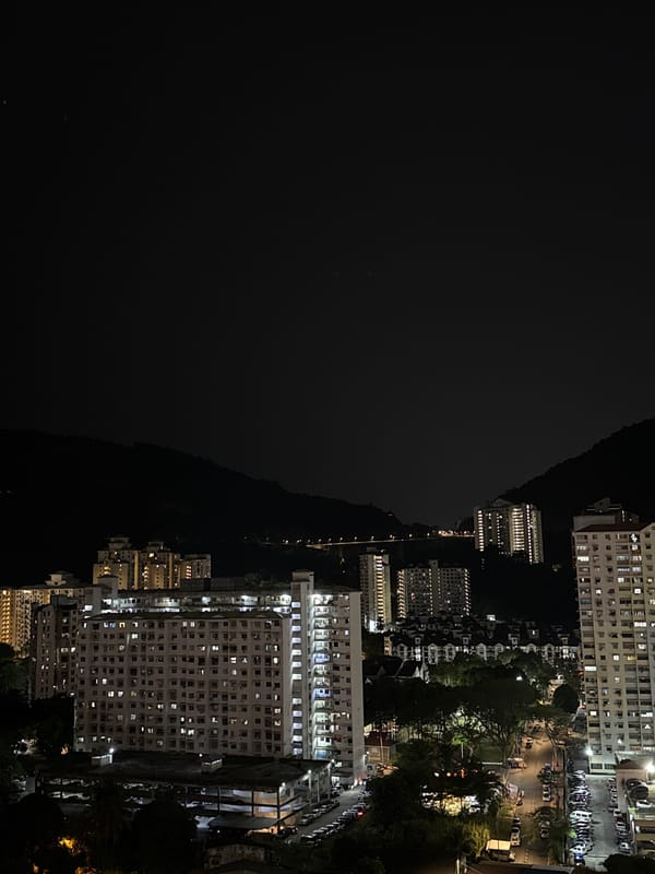 Night cityscape captured from elevated view in George Town