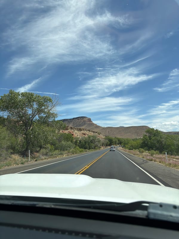 Vehicle passenger captures scenic road view in Virgin, Utah