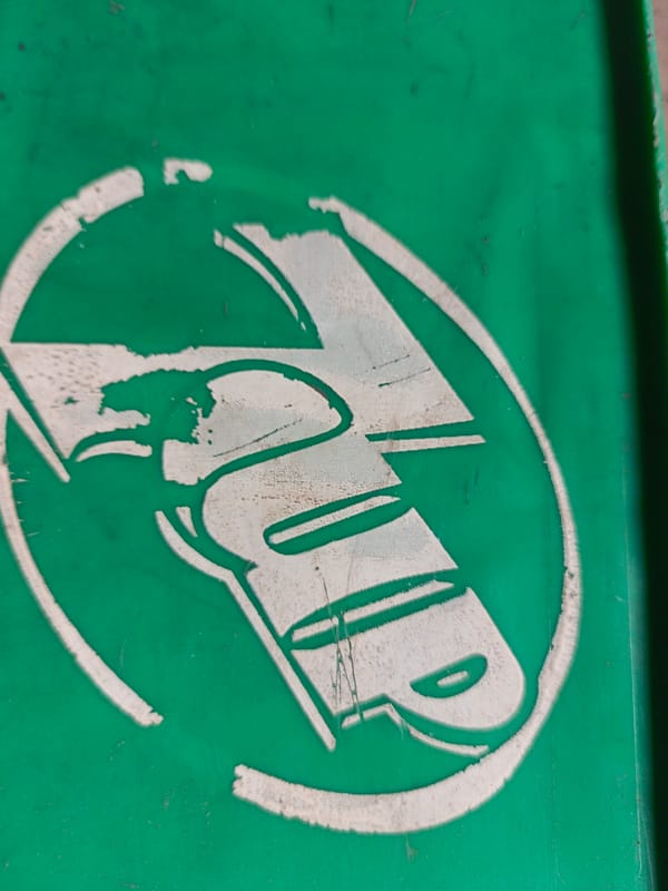 Ground debris and branded items observed at location