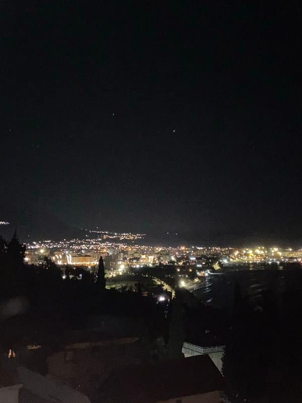 Nighttime photography session captures Šušanj cityscape and selfie portrait