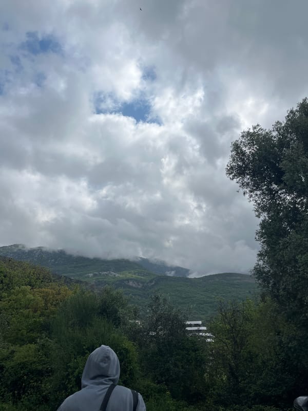 Morning scenes captured in Boreti, Montenegro show mountains and cafe