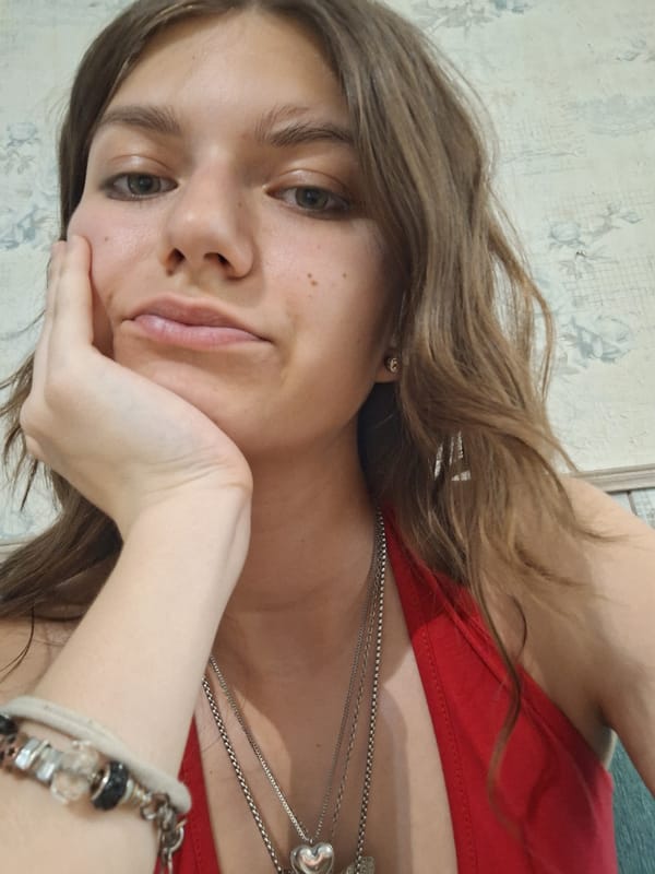 Woman takes selfies at Bulgarian cafe during midday visit